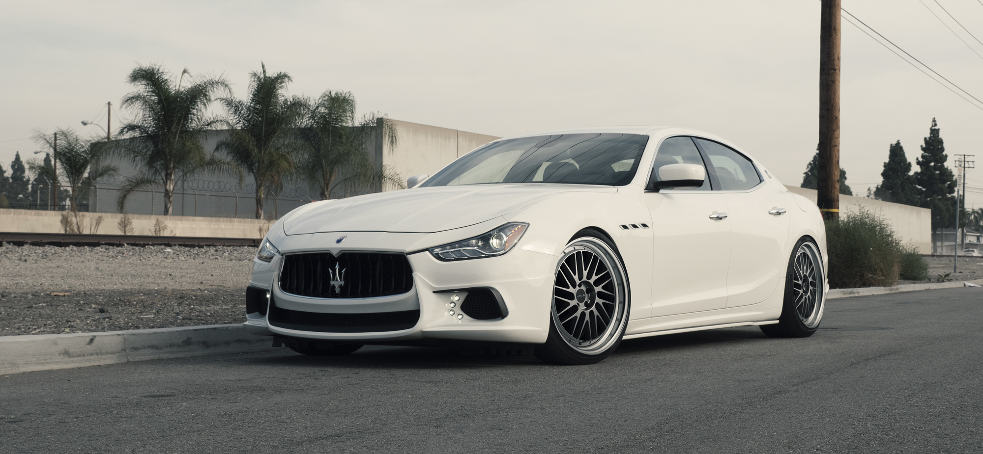 White Maserati Ghibli lowered on WALD TOSCA II T22-C wheels with polished lips