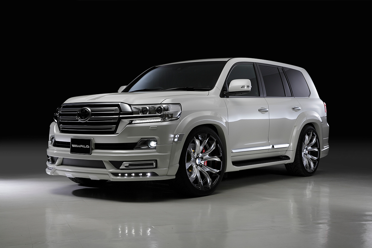WALD Land Cruiser 200 body kit — white studio front three-quarter view with front spoiler and wide arch package