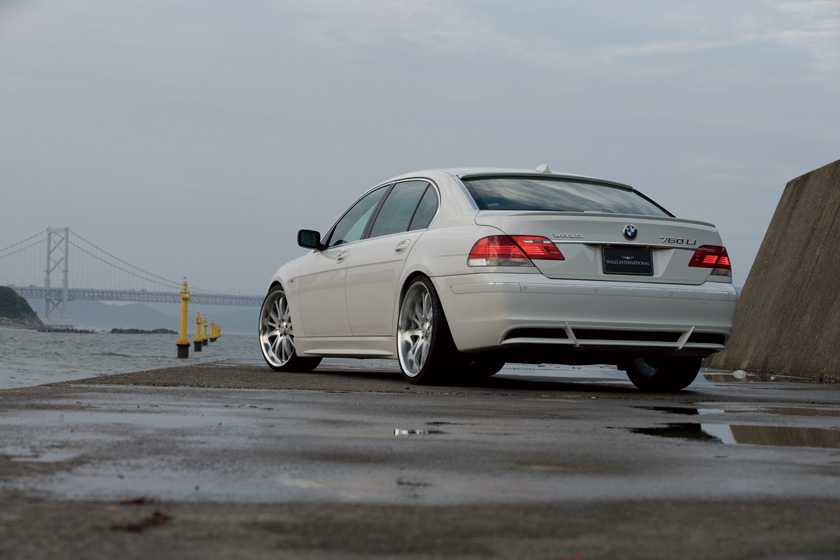 WALD BMW 7 Series E65 Sports Line rear quarter view of white 750Li with WALD boot spoiler and body kit