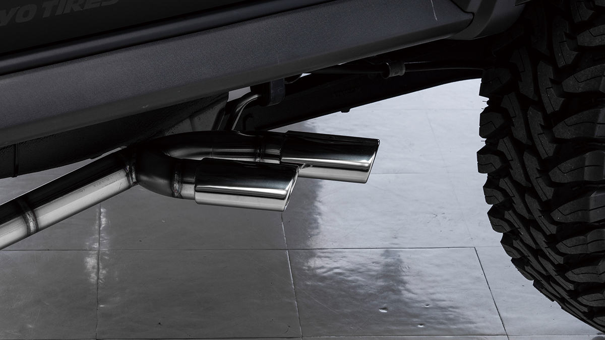 WALD Black Bison Edition Suzuki Jimny Sierra JB74W — stainless steel side exit exhaust tips beneath the side step