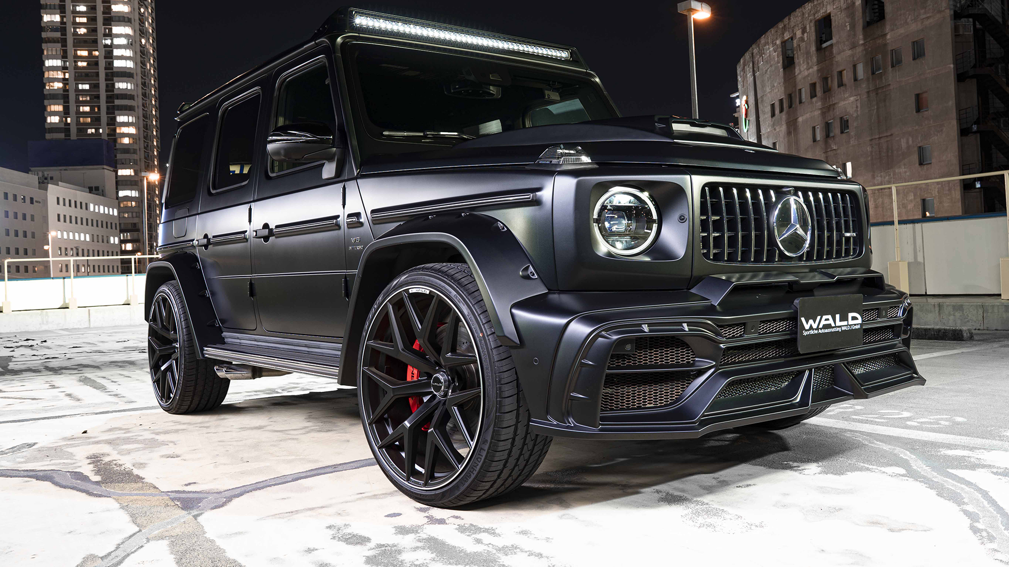 Matte black Mercedes-AMG G-Class WALD Black Bison on 24 inch WALD MB001 wheels with red brake calipers