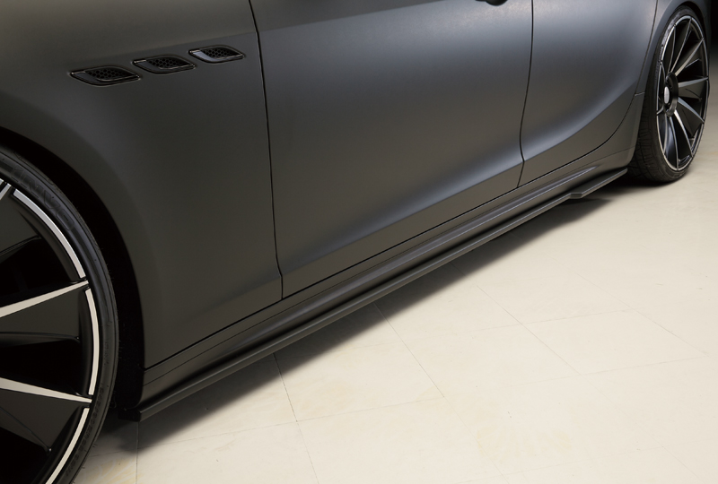 WALD Maserati Ghibli side skirt detail — WALD side skirt along the sill of a matte black Ghibli