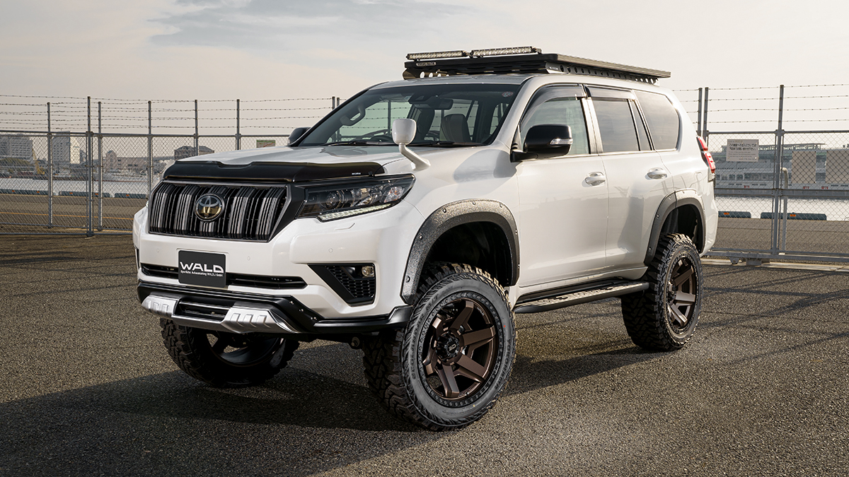 WALD Desert Line Toyota Land Cruiser Prado GDJ150W TRJ150W body kit in white with fender trim and bronze WALD wheels