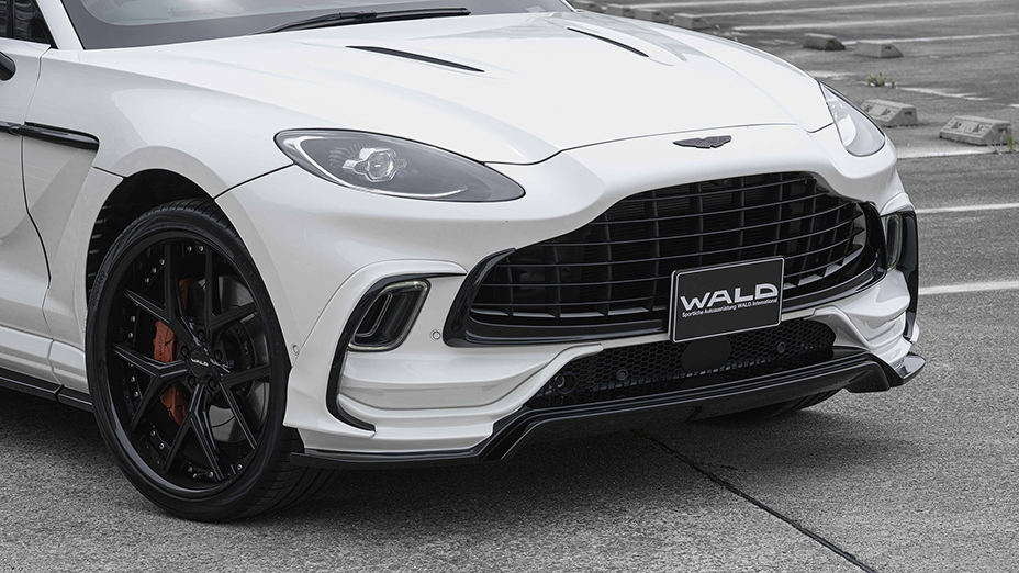 WALD Aston Martin DBX front body kit detail — WALD front lip spoiler, bumper duct garnish and grille close-up