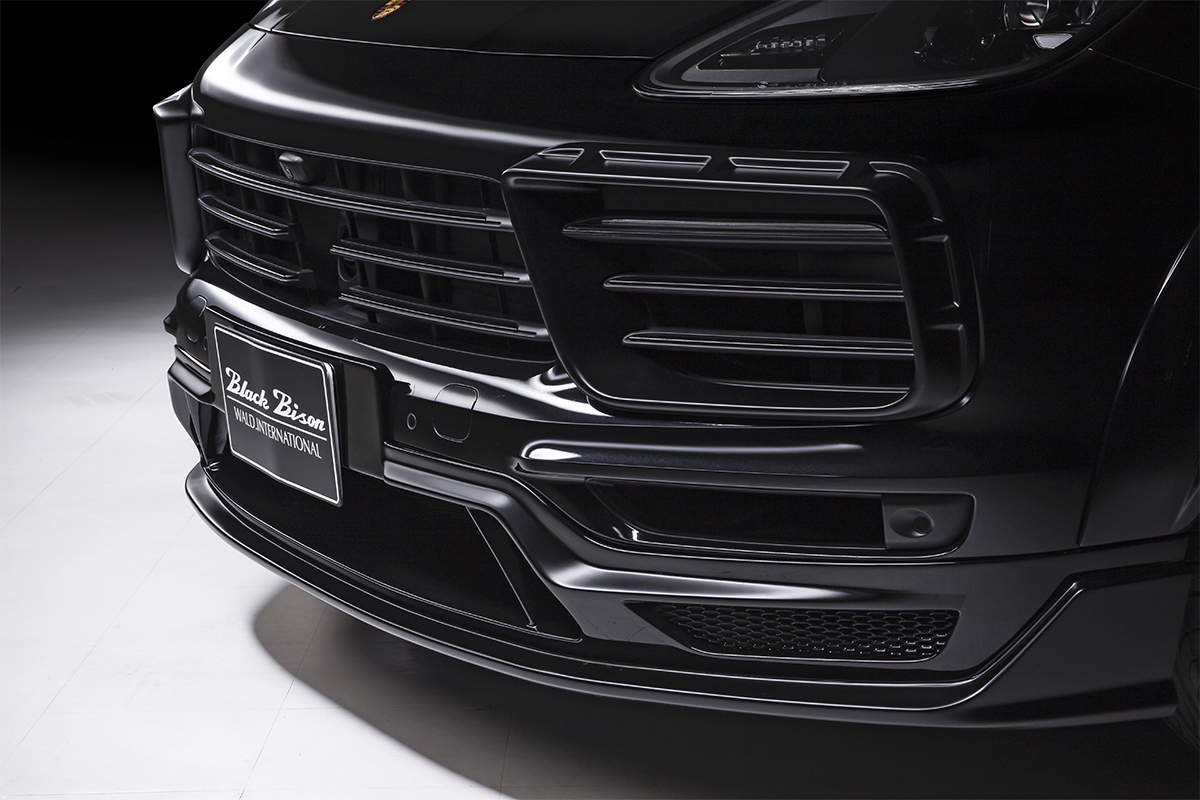 WALD Porsche Cayenne Coupe front spoiler detail — Black Bison front spoiler with net and grille close-up