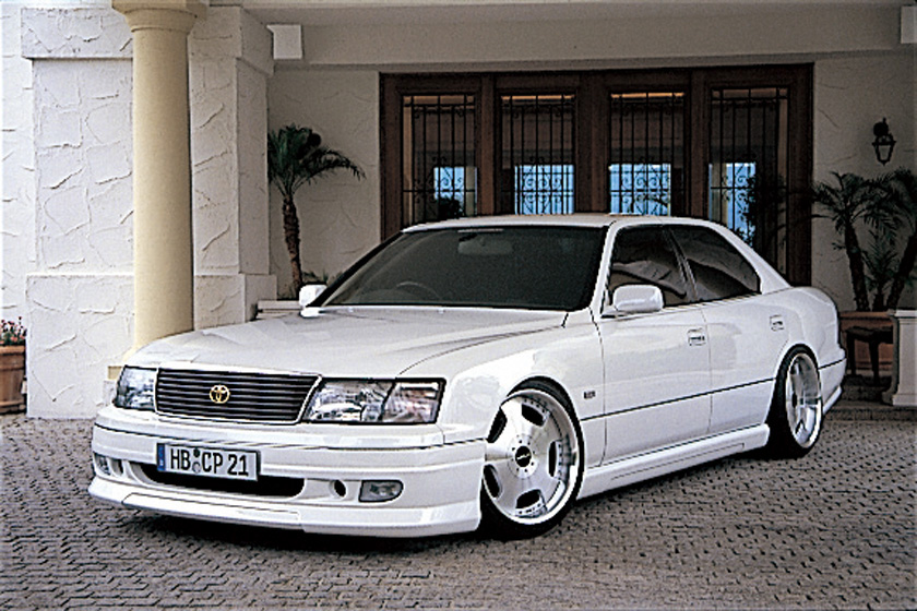 WALD Executive Line V3 Toyota Celsior UCF20/21 M/C before — white Celsior front three-quarter view with WALD front spoiler and deep-dish wheels