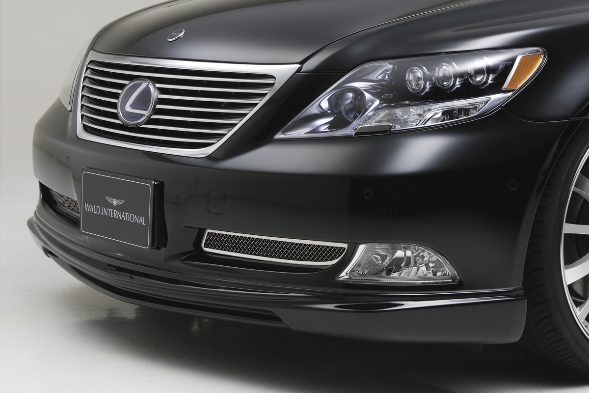 WALD Lexus LS460 front spoiler detail with chrome inner grille mesh and WALD International plate