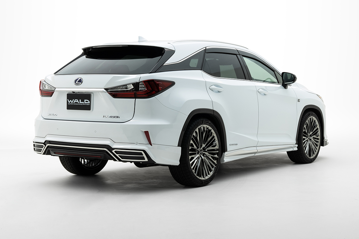 WALD Sports Line Lexus RX450h rear three-quarter studio view with WALD rear skirt and stainless steel trim
