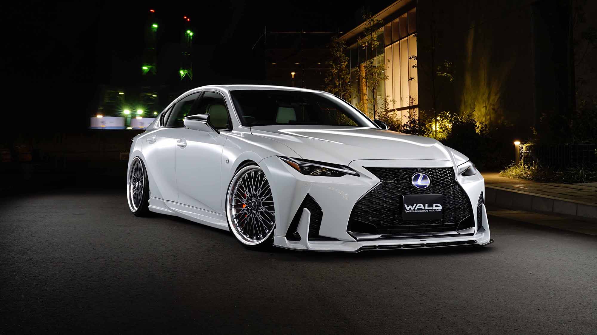 White Lexus IS with WALD aero on WALD Classic Mesh CM12C wheels, front three-quarter view