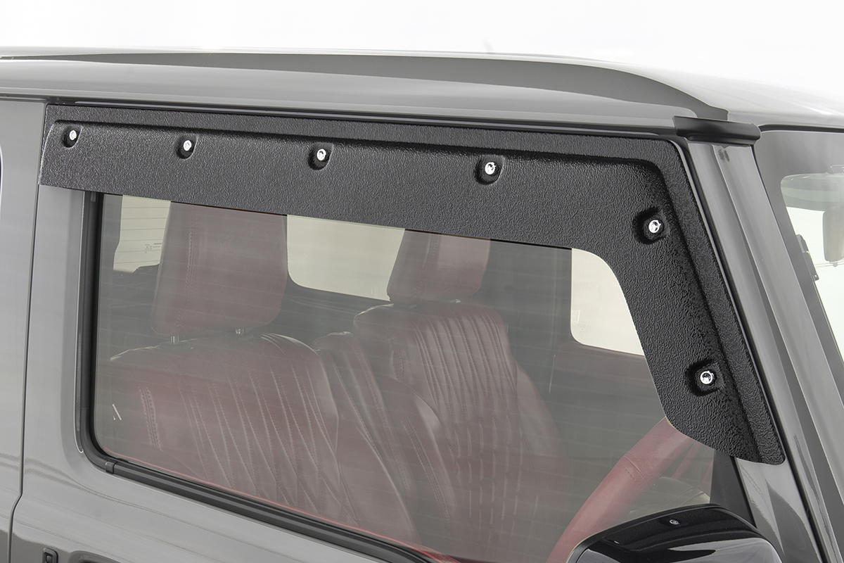 WALD Black Bison Edition Suzuki Jimny Sierra JB74W — close-up of the textured black rear quarter window garnish with decorative screws