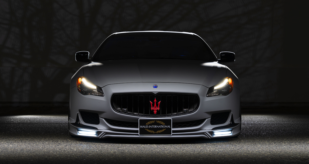 Head-on front view of the WALD Maserati Quattroporte Executive Line with LED lamps lit