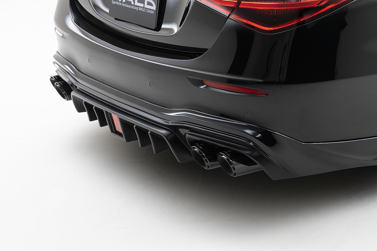 WALD Black Bison W223 rear diffuser with quad exhaust tips on a black Mercedes S-Class