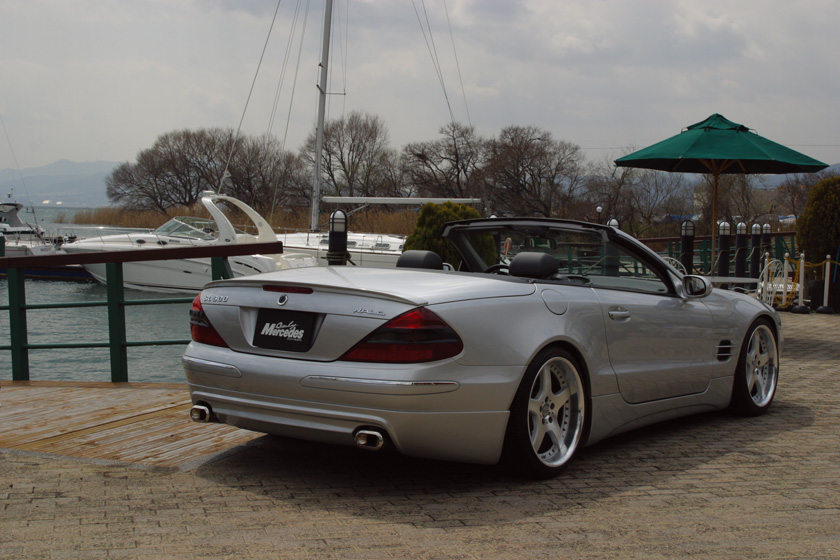 WALD Executive Line Mercedes-Benz SL-Class R230 rear three-quarter view at the marina with twin exhaust tips