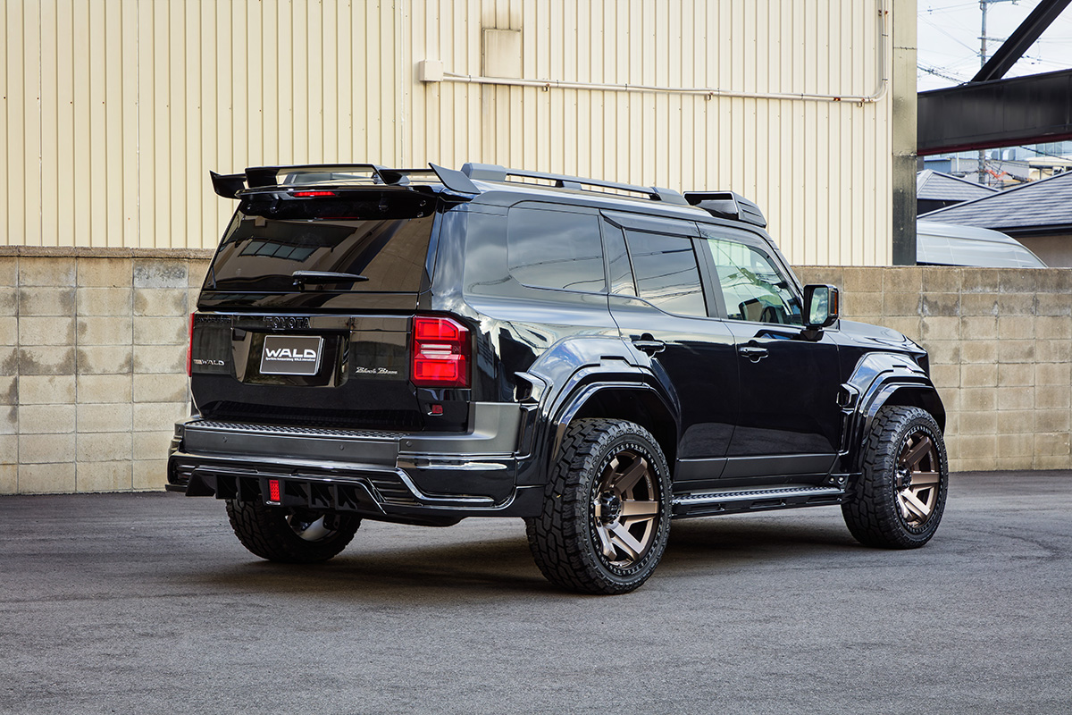 WALD Black Bison Land Cruiser 250 Prado rear three-quarter view with rear skirt and rear roof spoiler