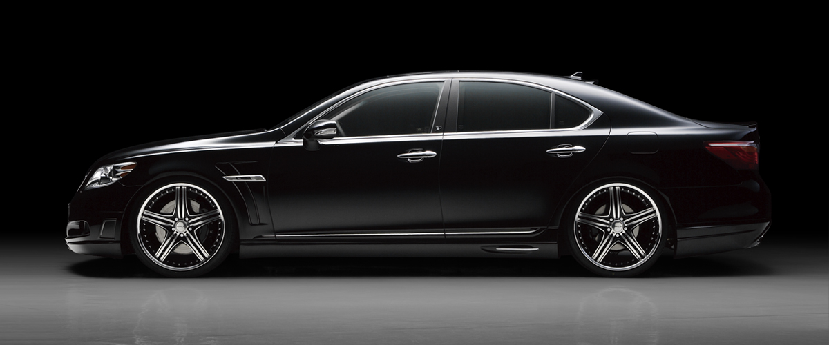WALD Executive Line Lexus LS460L side profile in black showing WALD side skirts and sport fender duct