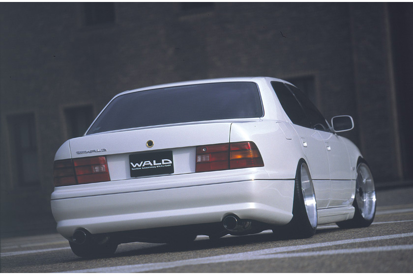 WALD Executive Line V3 Toyota Celsior UCF20/21 M/C before — low rear three-quarter view with WALD rear skirt, tail lamps and polished exhaust tips