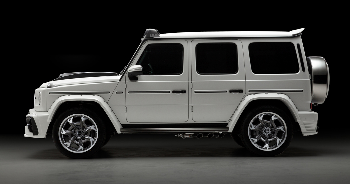 WALD G-Class W463A Black Bison side profile — white G-Class with wide arches, side exhaust and rear roof spoiler