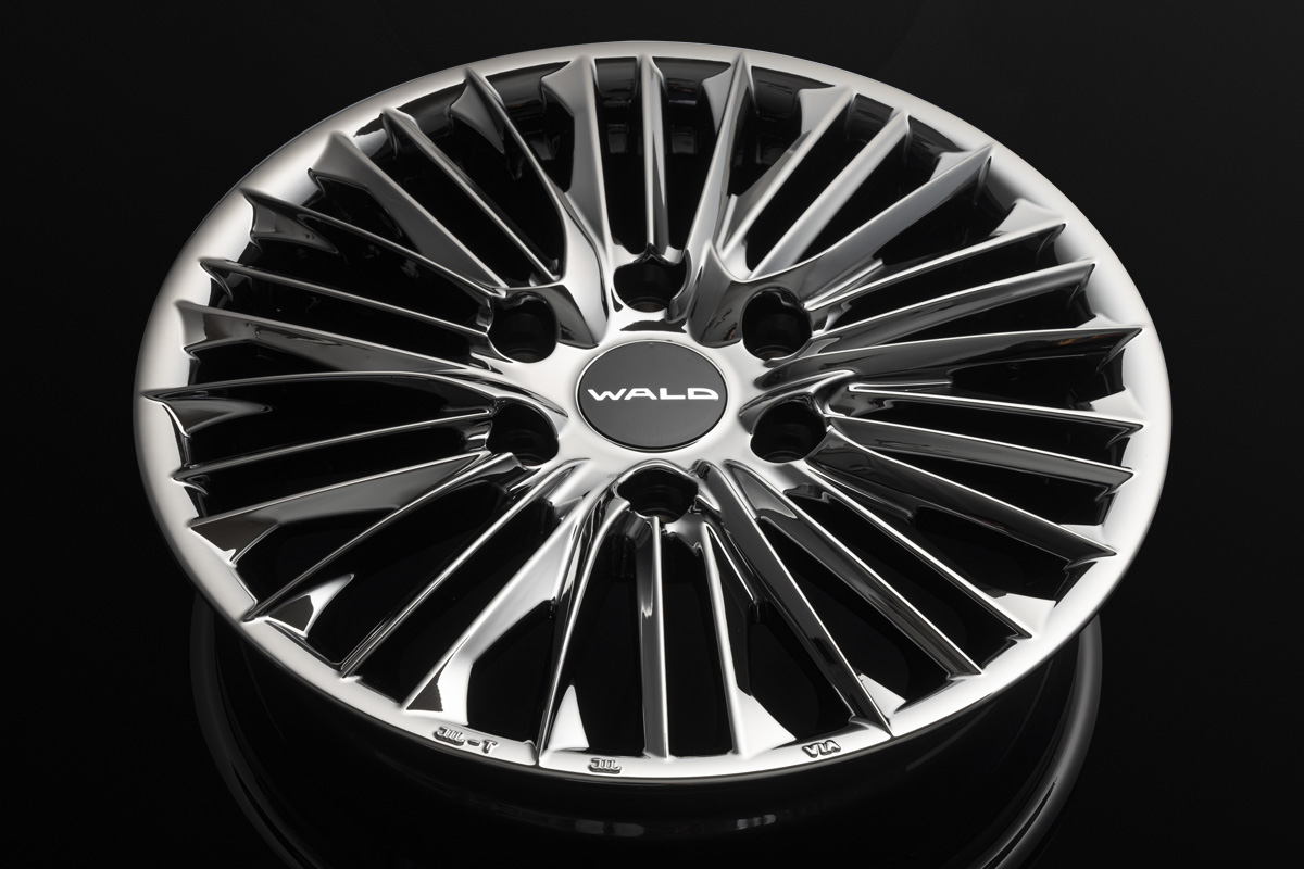 Full face studio view of the WALD F-001 wheel in SBC Super Black Coat with WALD centre cap