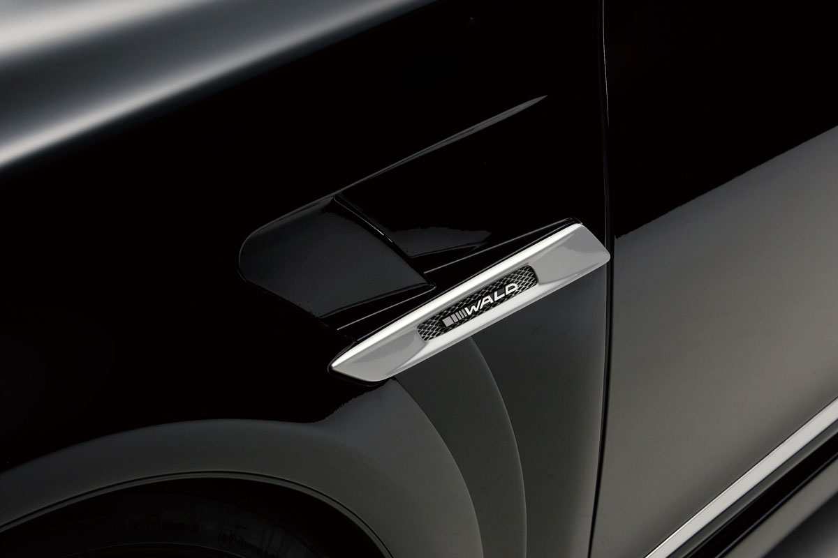 WALD Lexus LS600h chrome sport fender duct with WALD carbon emblem on black bodywork
