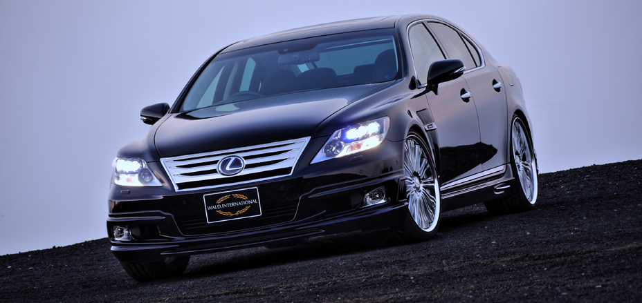 WALD Executive Line Lexus LS600h front three-quarter view with headlights lit and WALD International plate