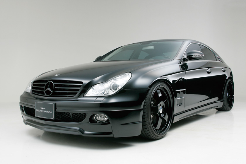 WALD Sports Line Mercedes-Benz CLS-Class C219 — black CLS studio front three-quarter view with WALD front spoiler and black multi-spoke WALD wheels