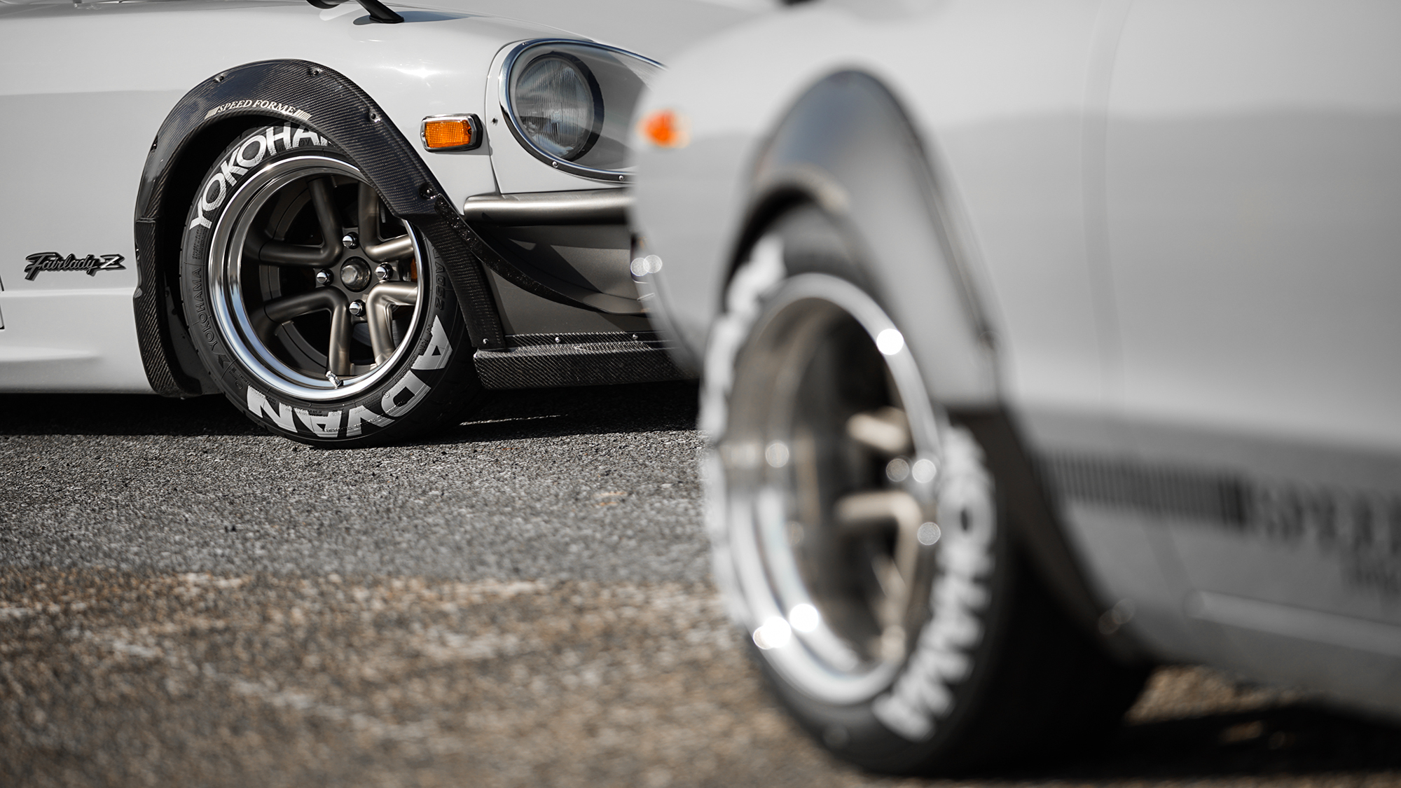 Front wheel detail of a Fairlady Z S30 running WALD Octopus Racing wheels