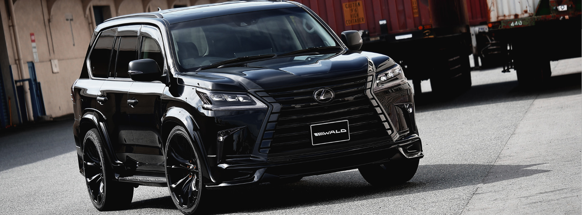 Black WALD Lexus LX570 Black Bison Edition front three-quarter view on gloss black WALD wheels