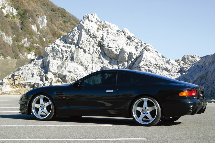 WALD Aston Martin DB7 body kit Europe — black DB7 side profile on-road with WALD Sports Line body kit and wheels