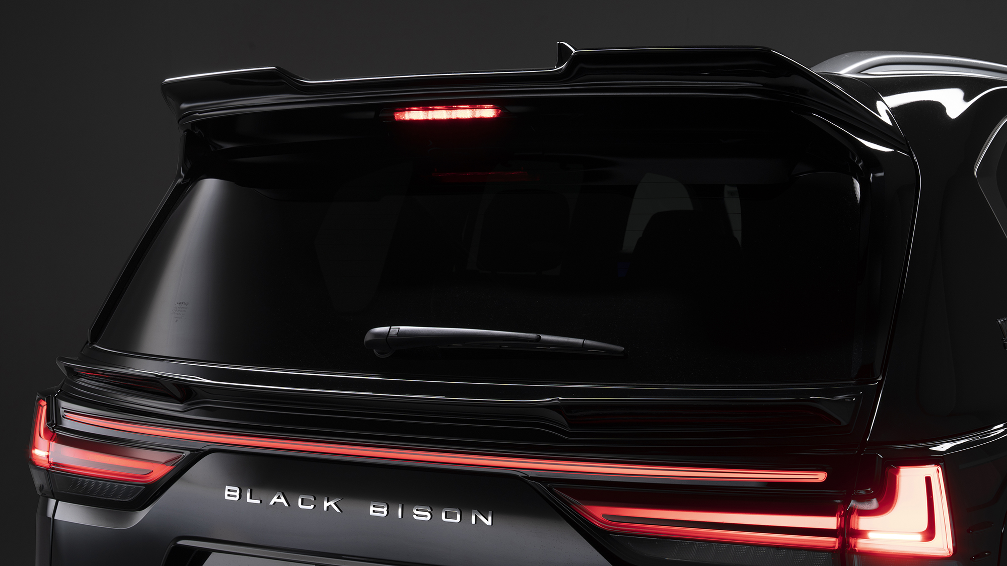 WALD Lexus LX600 rear roof spoiler and tailgate spoiler detail in gloss black