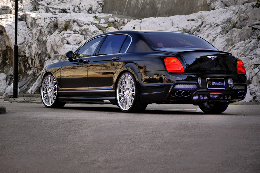 WALD Bentley Continental Flying Spur Black Bison rear three-quarter view with rear bumper spoiler and quad exhaust outlets