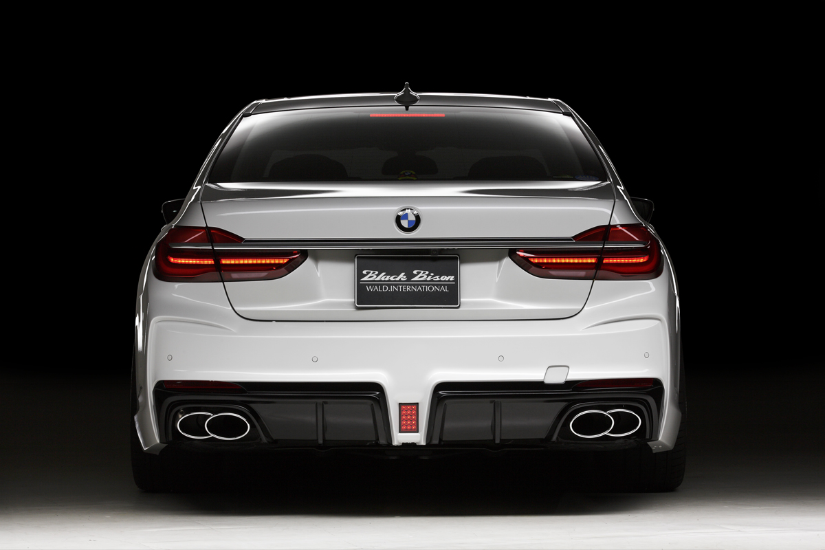 WALD BMW 7 Series G12 Black Bison direct rear view showing the diffuser-style rear bumper spoiler and LEDBGL175 LED lamp