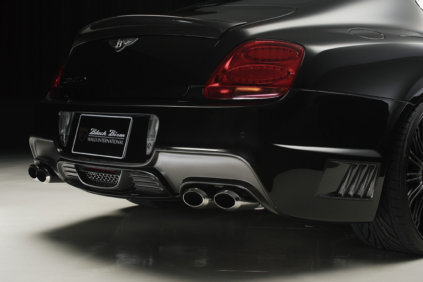 WALD Bentley Continental GT rear body kit detail — Black Bison rear bumper spoiler with mesh vent and oval 120W exhaust mufflers