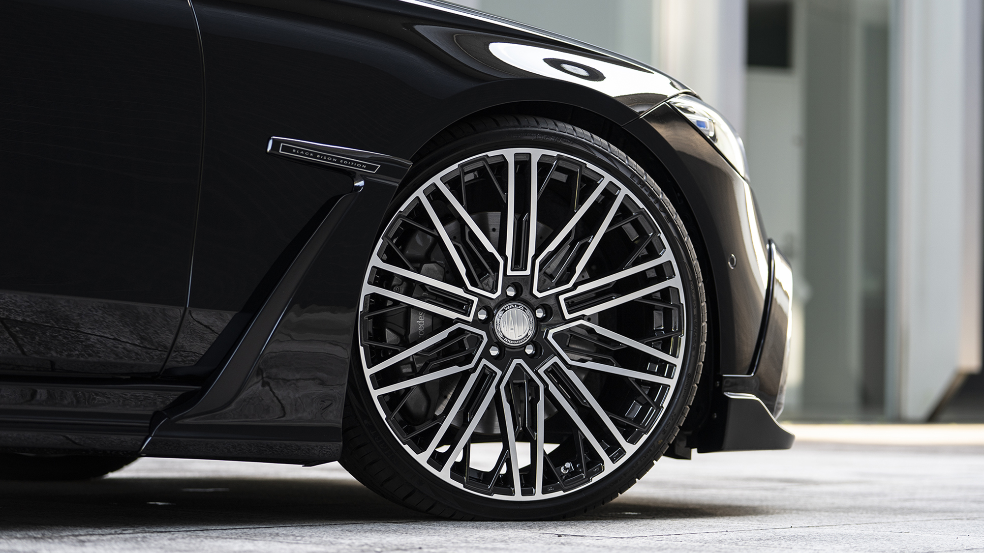 Front wheel detail of a WALD Black Bison Mercedes-Benz on a 22 inch BM001 Black Polish wheel