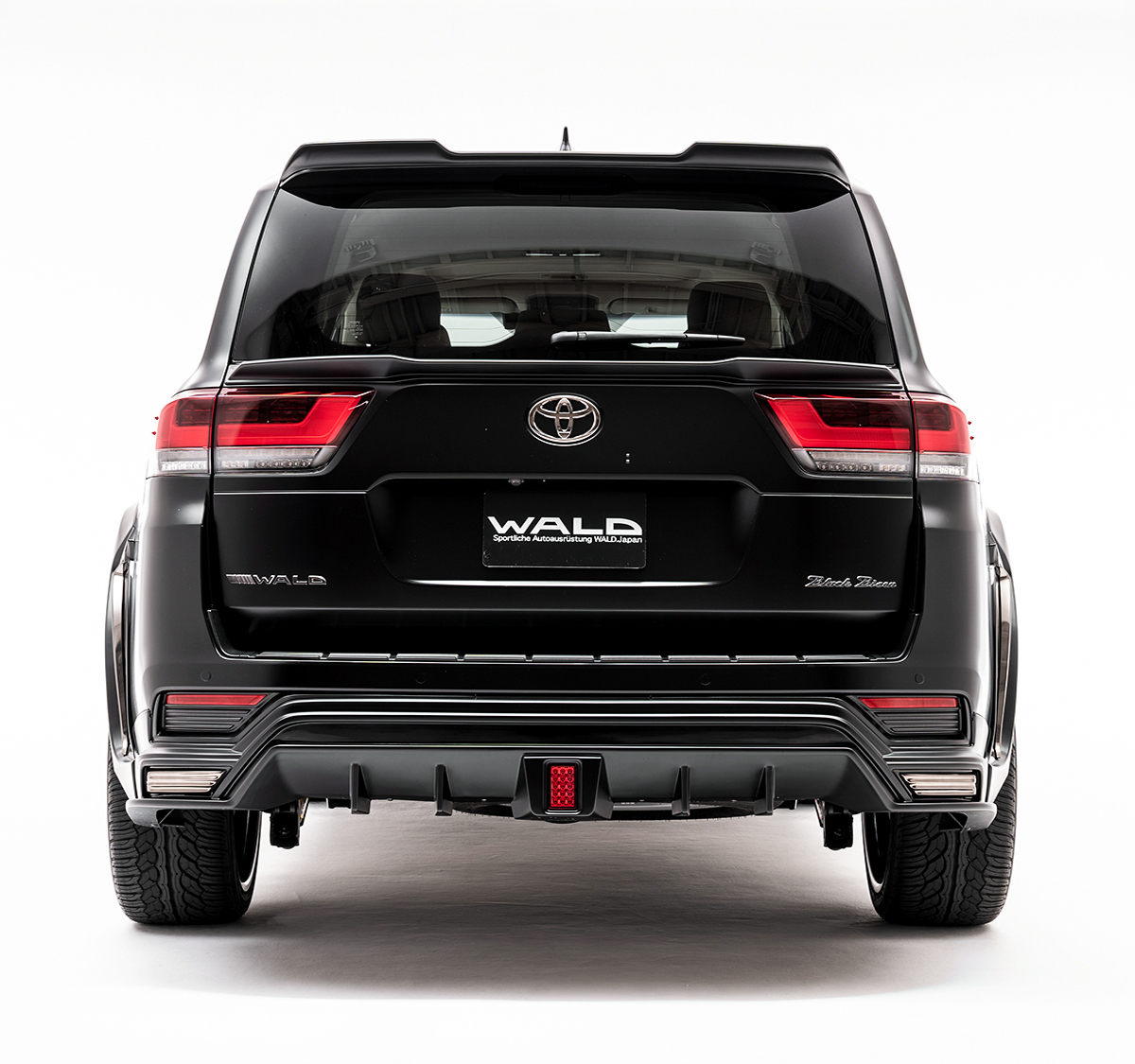 WALD Black Bison Land Cruiser 300 rear view with rear skirt diffuser and LED lamp