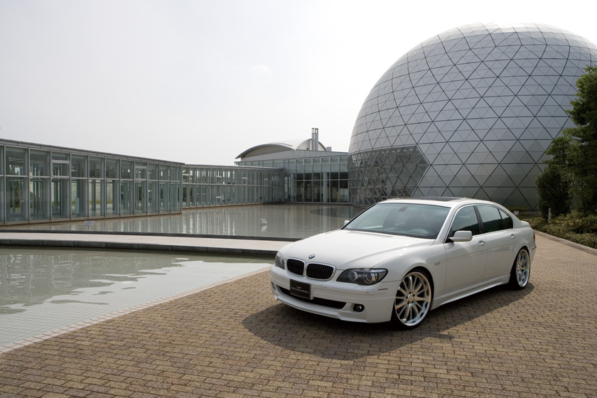 WALD BMW 7 Series E65 body kit 2005–2008 photographed outdoors, front three-quarter view of white WALD Sports Line saloon
