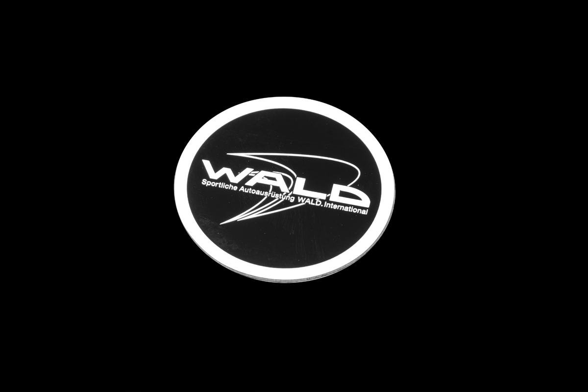 WALD Black Bison Edition Suzuki Jimny Sierra JB74W — WALD International metal emblem badge shown on a black background
