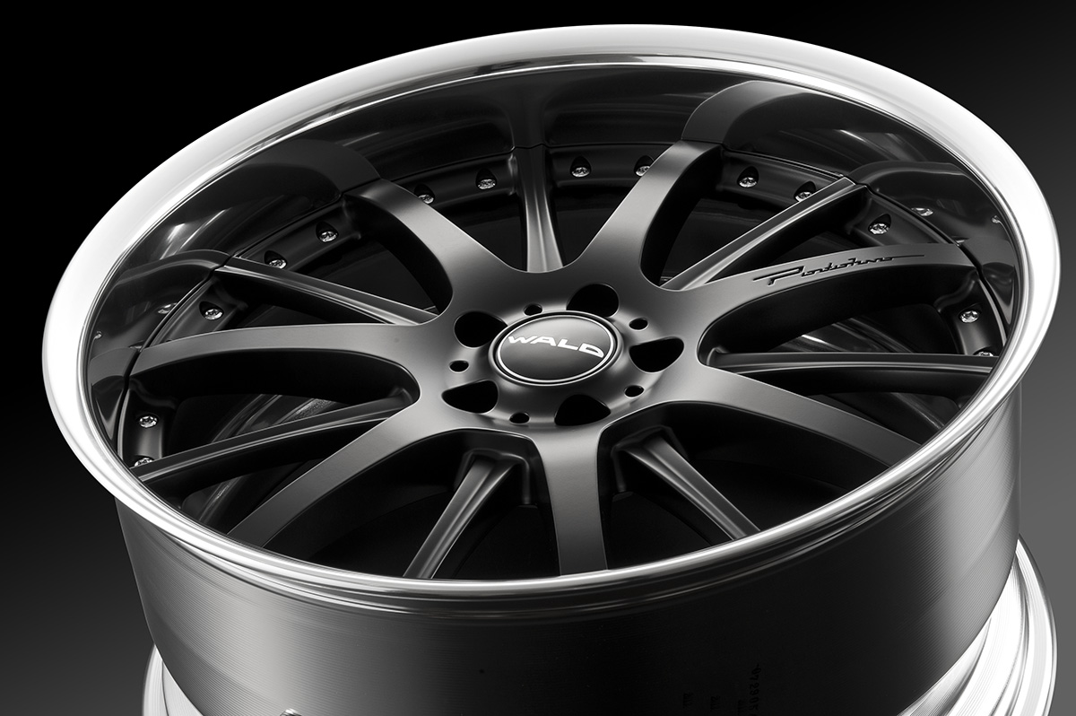 Angled studio view of the WALD Portofino P12C 2-piece forged wheel in matte black with polished rim lip