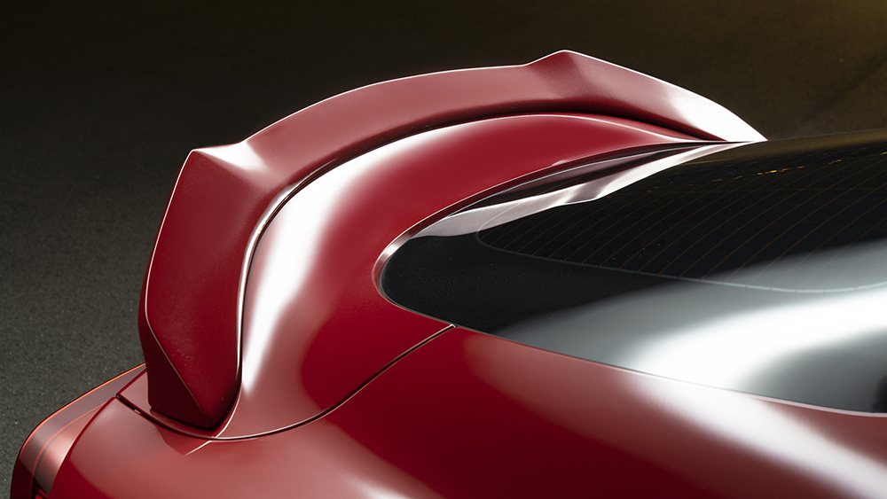 Close-up of the WALD rear wing on the red Toyota Supra DB## Sports Line conversion