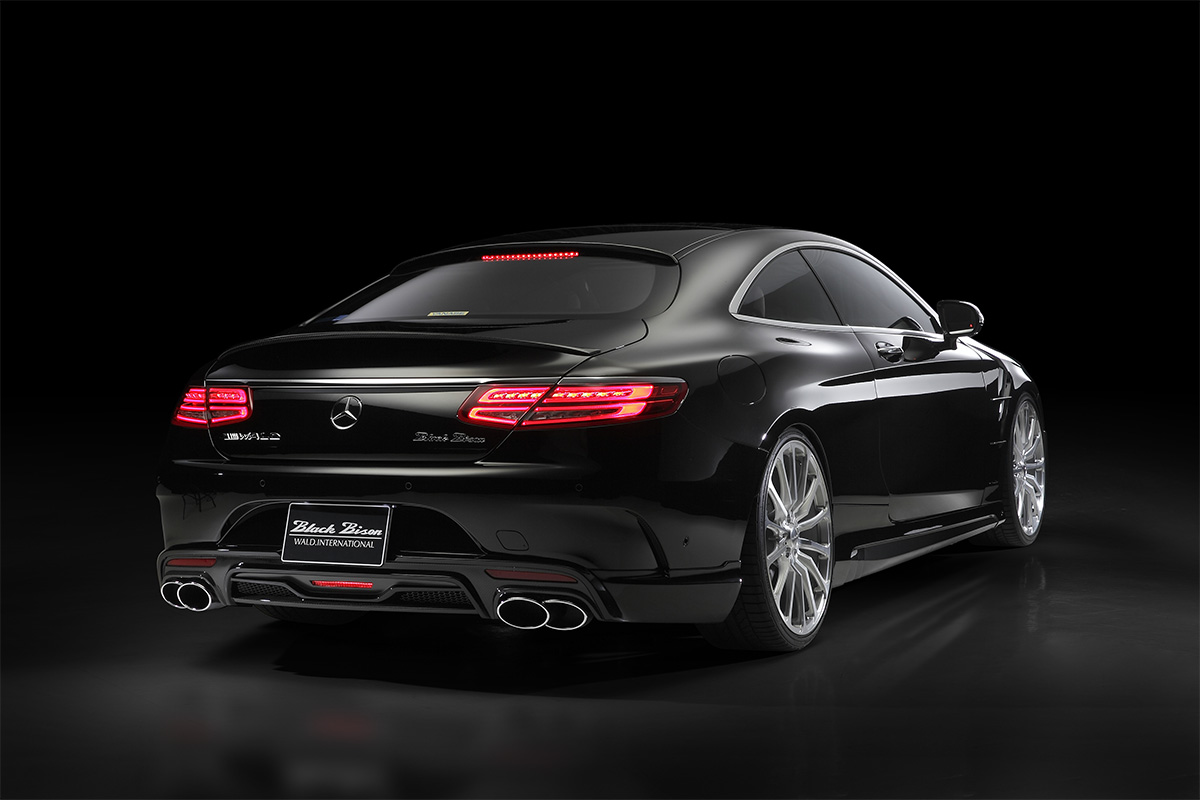 Mercedes C217 body kit rear three-quarter studio view with WALD rear skirt and quad exhaust tips