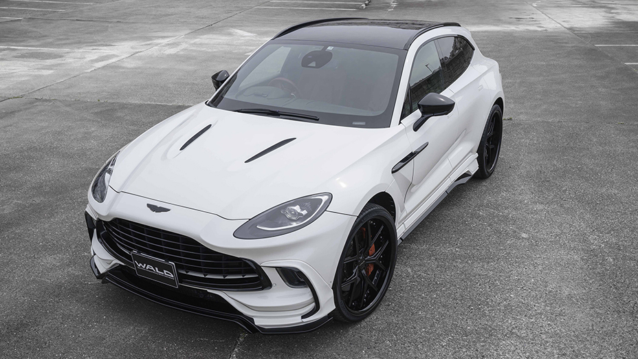 WALD Aston Martin DBX body kit UK — high-angle front three-quarter view of white DBX with complete Black Bison Edition kit