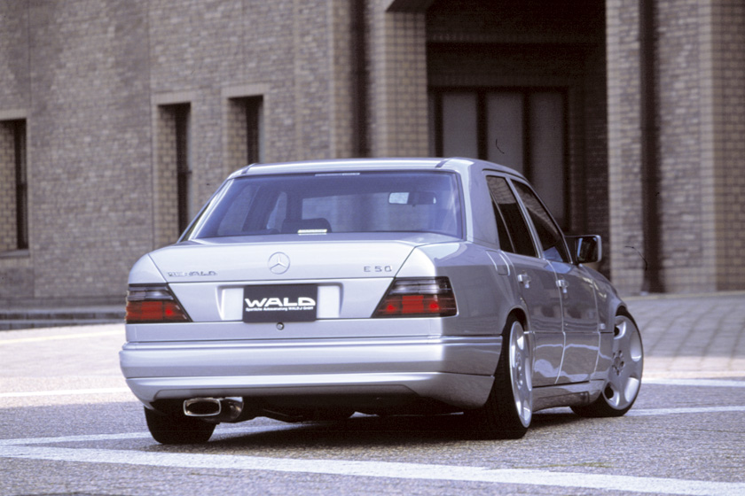 Mercedes-Benz E-Class W124 WALD Executive Line rear three-quarter view with rear skirt and boot spoiler