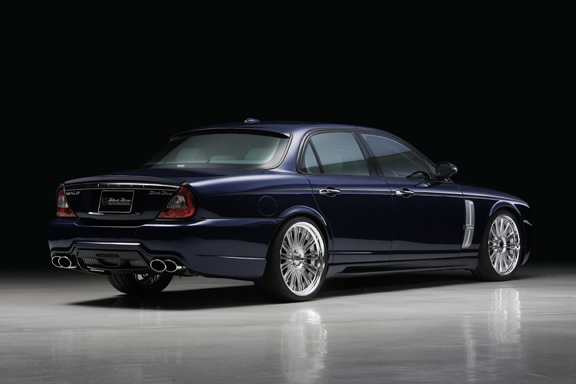 Jaguar XJ X358 WALD body kit — rear three-quarter view with WALD rear bumper spoiler and twin exhaust tips