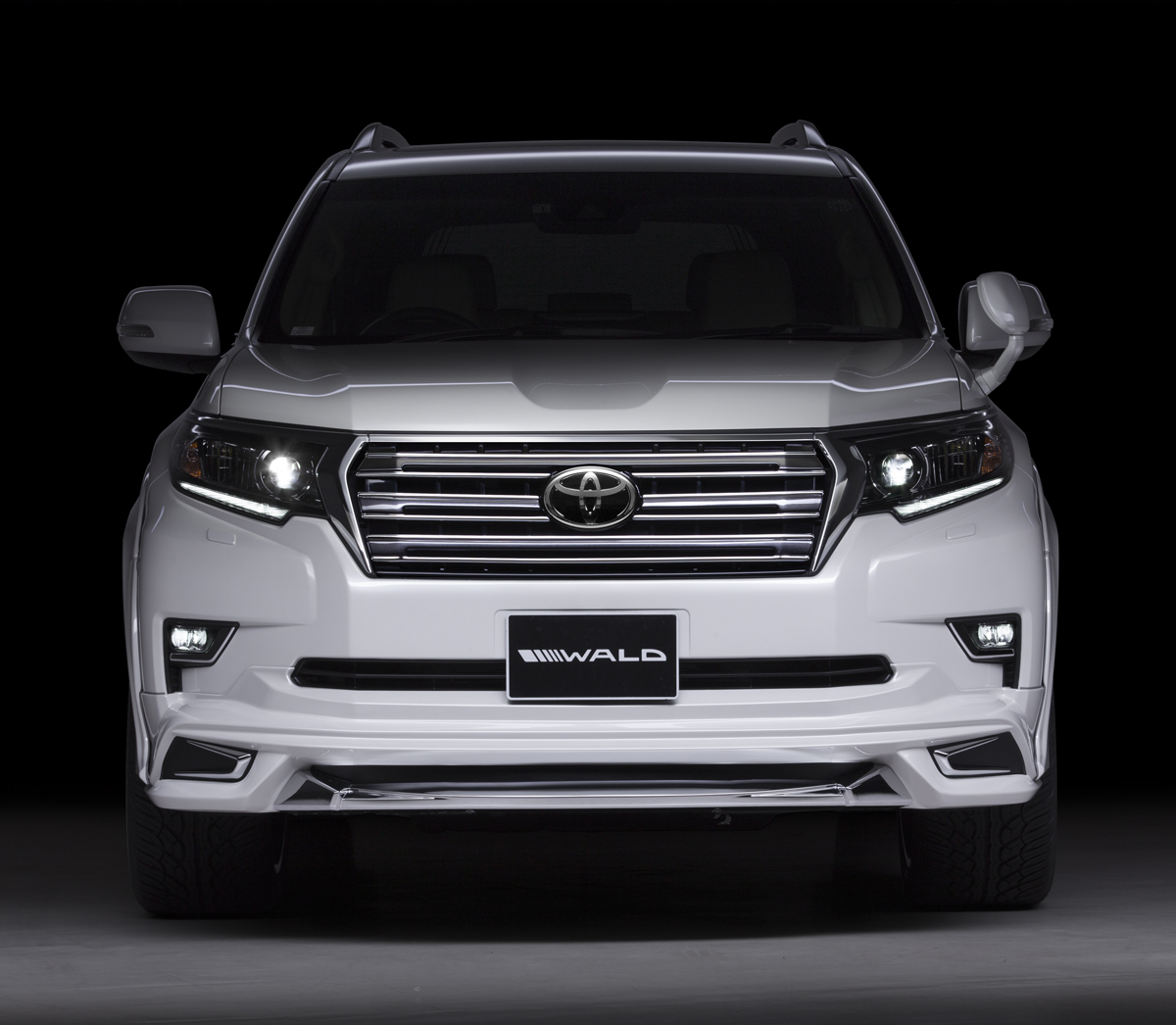 WALD Sports Line Prado 150 head-on front studio view with WALD front grille and front spoiler