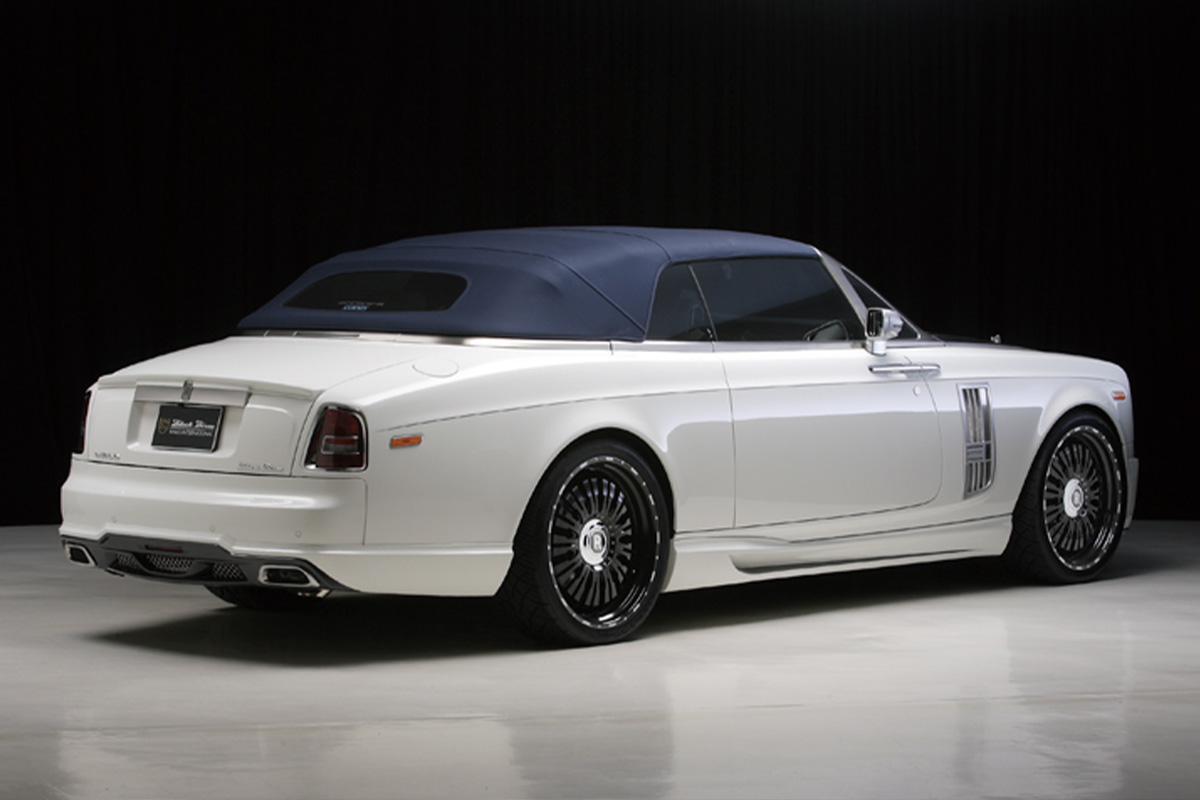 White Rolls-Royce Phantom Drophead Coupe rear three-quarter view on WALD RENOVATIO 1 RR wheels