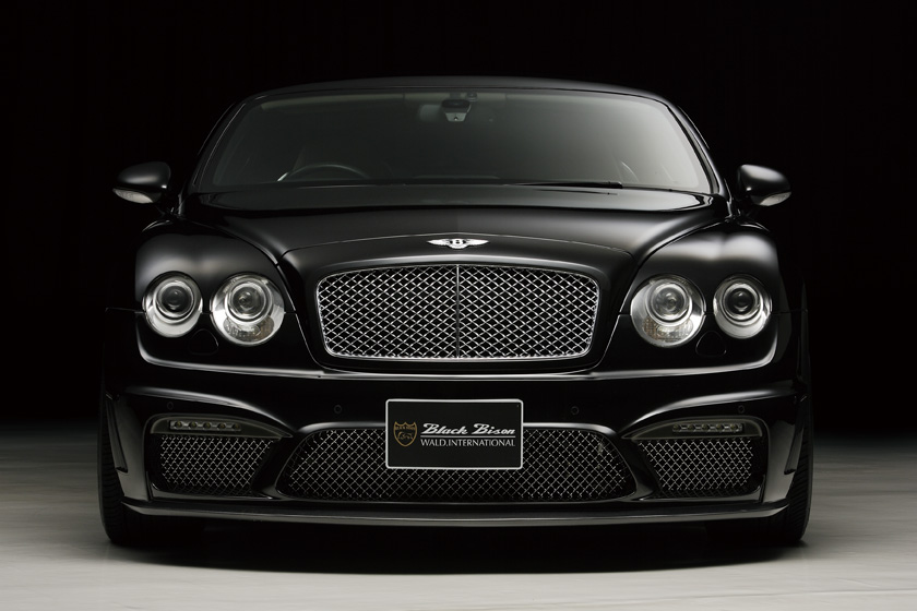WALD Bentley Continental GT Black Bison 2008–2010 — studio front view showing WALD front lip spoiler with mesh grille and LED lamps