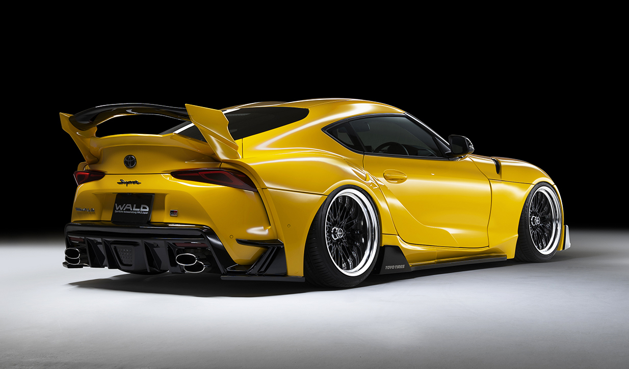 WALD Sports Line Supra rear three-quarter studio view with rear over fenders, rear diffuser and rear wing