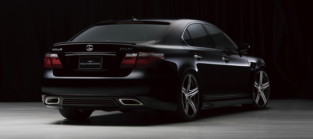 WALD Executive Line V1 Lexus LS600hL rear three-quarter studio view with WALD rear skirt and boot spoiler