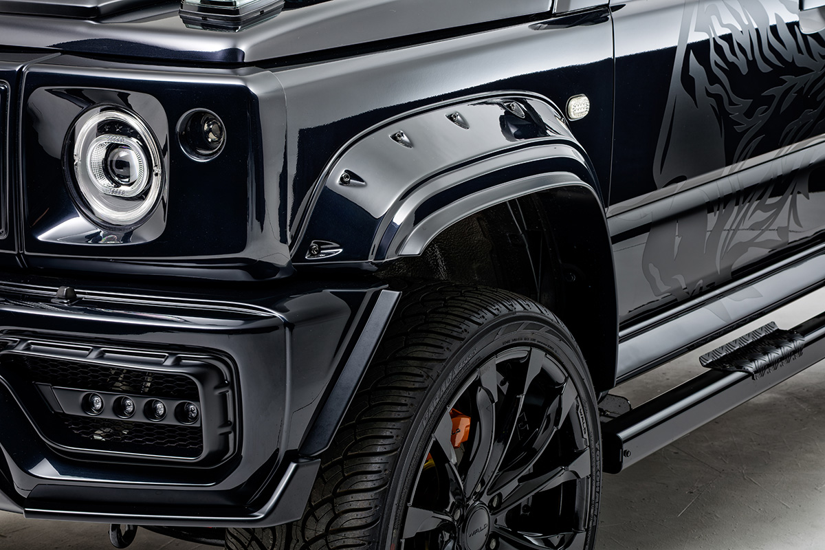 WALD Black Bison Edition Suzuki Jimny Nomade JC74W — front arch detail with wide arch package, decorative screws and LED indicator