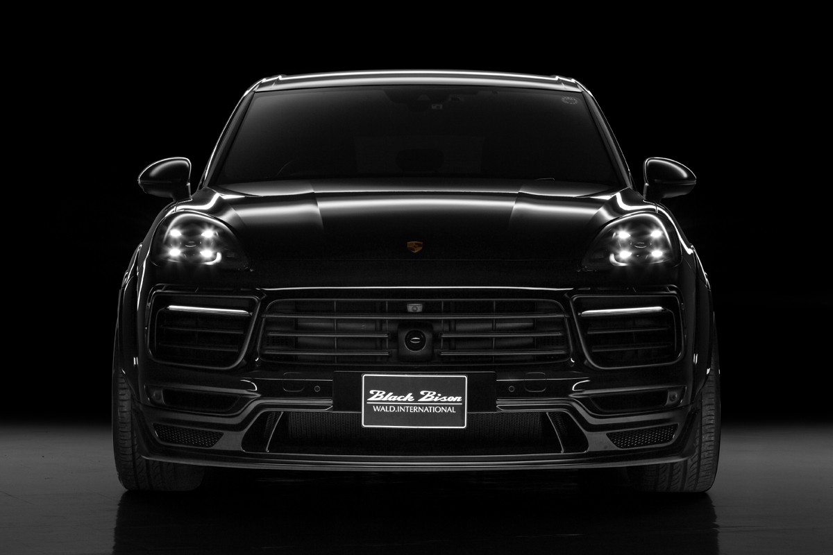 WALD Porsche body kit — black Porsche Cayenne Black Bison with WALD front bumper and lower lip spoiler