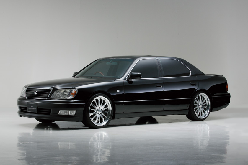 WALD Executive Line Toyota Celsior UCF20/21 — low front three-quarter studio profile with WALD side skirts and polished multi-spoke wheels